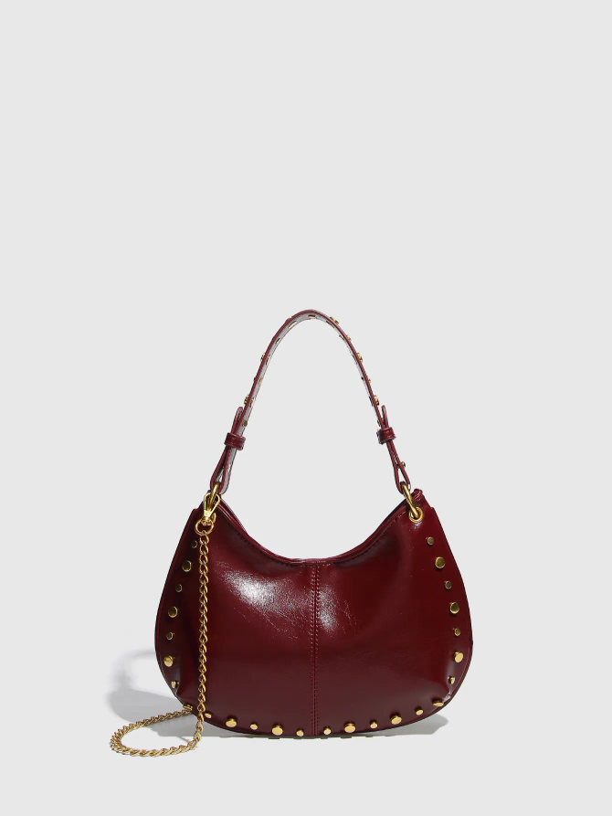 Studded Saddle Shoulder Bag with Gold Accents.