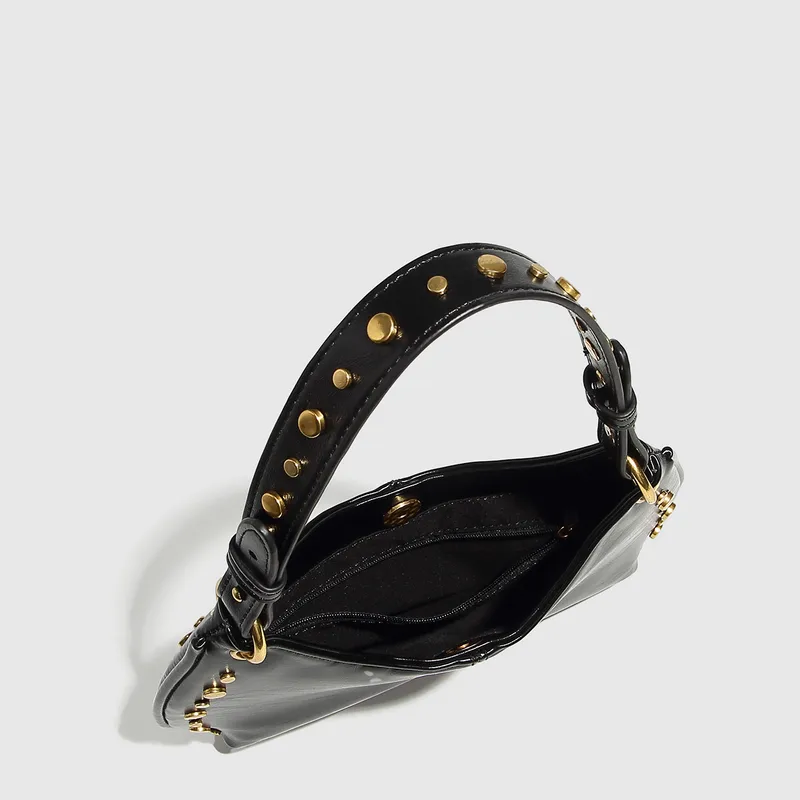 Studded Saddle Shoulder Bag with Gold Accents.